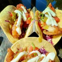 Crispy Baja Fish Tacos  · Beer battered red snapper, salsa verde, cabbage slaw, sour cream, pico de gallo, limes