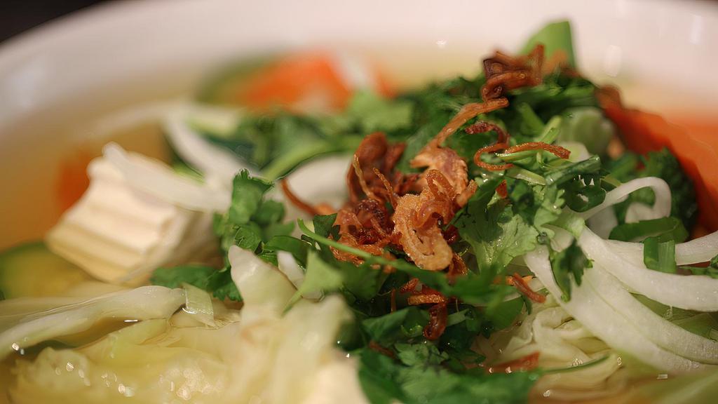 Veggie Pho (Vegan) · Vegan, gluten-free. No meat product. Aromatic vegetable broth topped with tofu, broccoli, carrots, mushrooms, zucchini, cabbage, and crispy fried onions (beef broth or chicken broth on request).