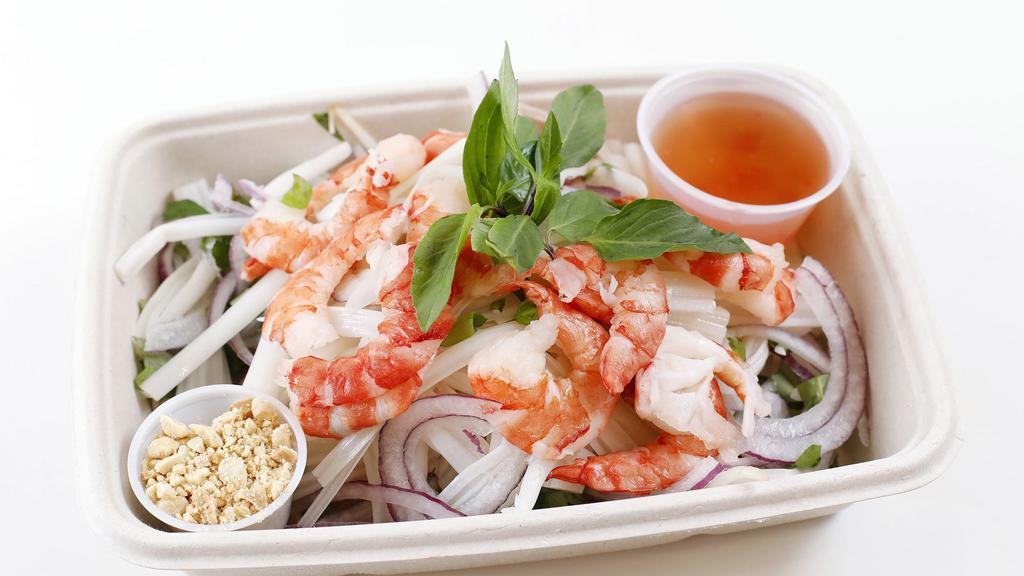 Lotus Root Salad · Mixed with shrimp, shredded carrots and daikon, shaved red onion, tossed with Vietnamese vinaigrette dressing, topped with freshly roasted peanuts, cilantro, mint, and rau ram (hot mint).