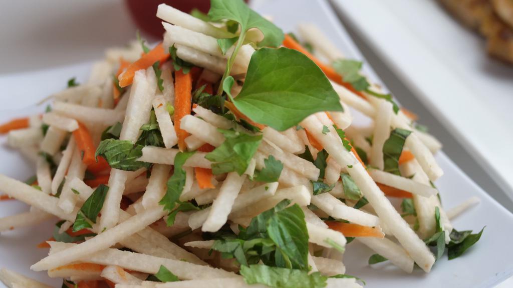 Jicama Salad (Choice of Chicken or Shrimp).) · Gluten-free. Julienne fresh  Jicama, carrots, slices of red onions, mixed with Vietnamese exotic herbs, tossed in sweet and spicy fish sauce vinaigrette dressing, topped with honey roasted peanuts.