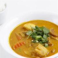 Lemongrass Curry Chicken · Boneless chicken thigh stewed with carrots, taro root, and potatoes in coconut milk.