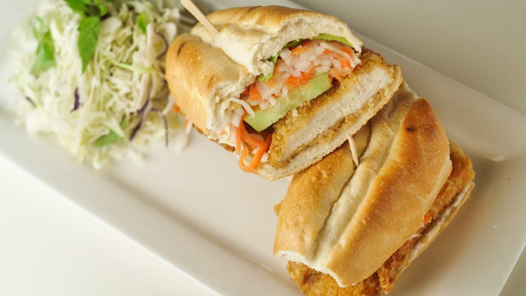 Vietnamese Chicken Po' boy · Vietnamese-Louisiana style fusion Banh Mi with battered fried chicken served on torpedo French roll with sweet & spicy aioli sauce