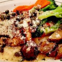 Salmon Piccata · Grilled wild salmon topped with a white wine, lemon and caper sauce.