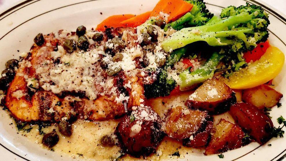 Salmon Piccata · Grilled wild salmon topped with a white wine, lemon and caper sauce.