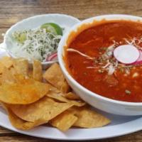 Pozole · Hominy pork stew from Jalisco in a chili broth pepper base, served with cabbage, radish, oni...
