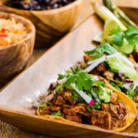Tacos de Plazas · Choice of meat, onions, cilantro and salsa de tomatillo.