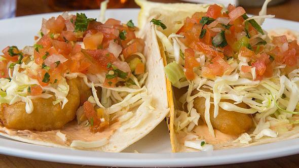 Baja Fish Taco · Battered fried local cod, chipotle crema, shredded cabbage, pico de gallo and lime