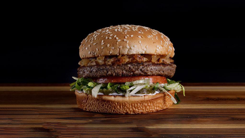 Original Impossible (Tm) Burger · A seared Impossible patty (a plant-based alternative patty) topped with caramelized onions, crisp lettuce, tomato, pickles, mayo on a toasted bun.  Impossible is a trademark of Impossible Foods, Inc. Used under license.
