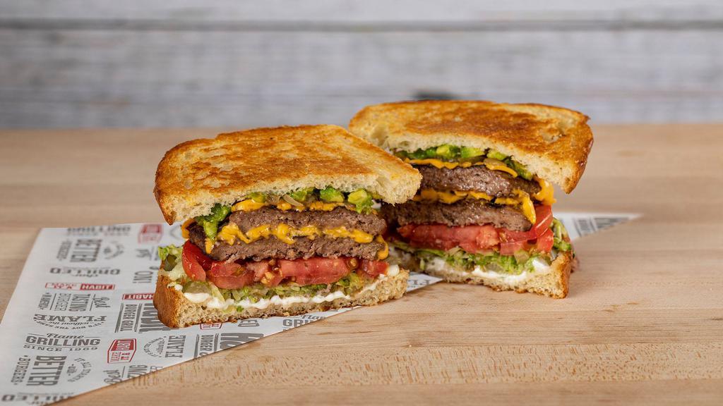 Santa Barbara Char · Two freshly chargrilled beef patties, avocado, caramelized onions, American cheese, crisp lettuce, tomato, pickles and mayo on grilled sourdough.