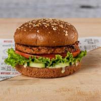 Veggie Burger · Vegan veggie patty on a toasted wheat bun, green leaf lettuce, fresh tomatoes, and cucumbers...