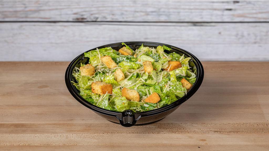 Caesar Salad · Chopped Romaine tossed in our Caesar dressing, croutons and freshly grated Parmesan cheese.