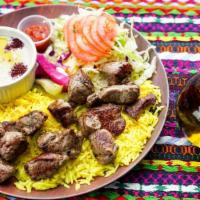 Shish Kabab · 2 skewers of chicken, kabab or lamb, salad, hummus, rice and pita bread.