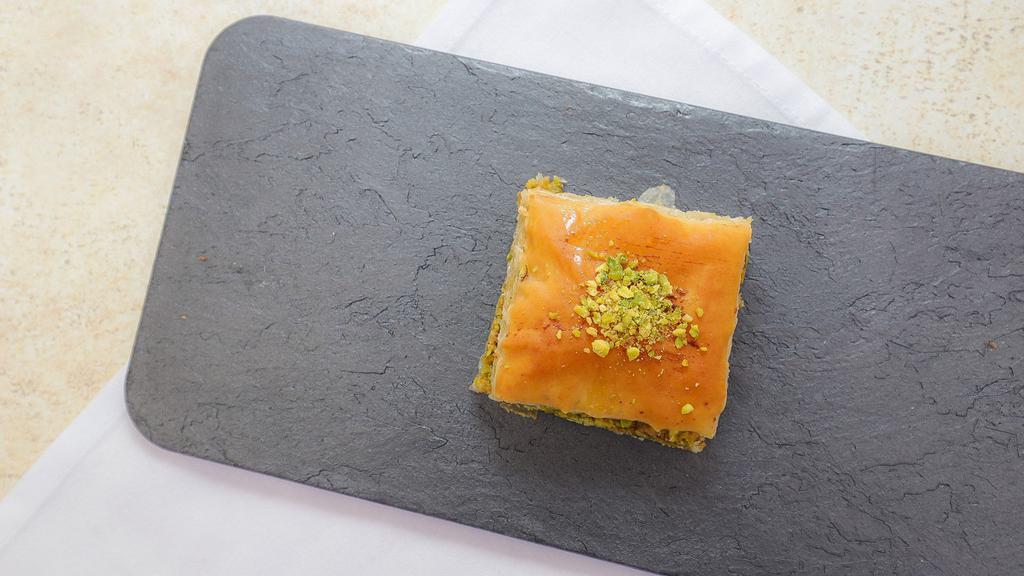 Pistachio Baklava · Layers of buttered fillo dough filled with pistachio and orange blossom water sweetened with orange blossom sugar syrup. package of 4 pieces.
