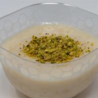 Rice Pudding · Aromatic rice pudding, flavored with Mastic and Orange blossom water,