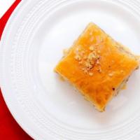 Walnut Baklava · Layers of buttered fillo dough filled with walnut and orange blossom water sweetened with or...