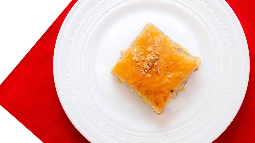 Walnut Baklava · Layers of buttered fillo dough filled with walnut and orange blossom water sweetened with orange blossom sugar syrup. Package of 4 pieces.
