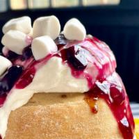 Blueberry Blitz Roll 
 · lemon crème frosting topped with blueberry preserves and marshmallows
