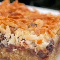 Magic Cookie Bars 
 · a rich layered cookie bar with graham cracker crust, plant based sweetened condensed soy mil...