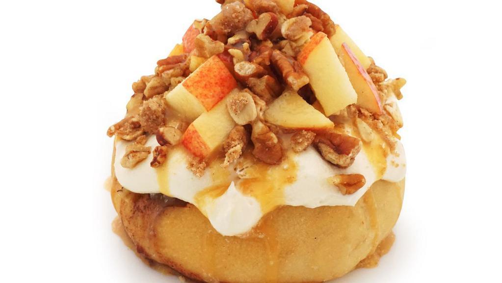 Caramel Apple Pie Roll · caramel frosting topped with fresh apples, pecans, homemade pie crumble and caramel sauce