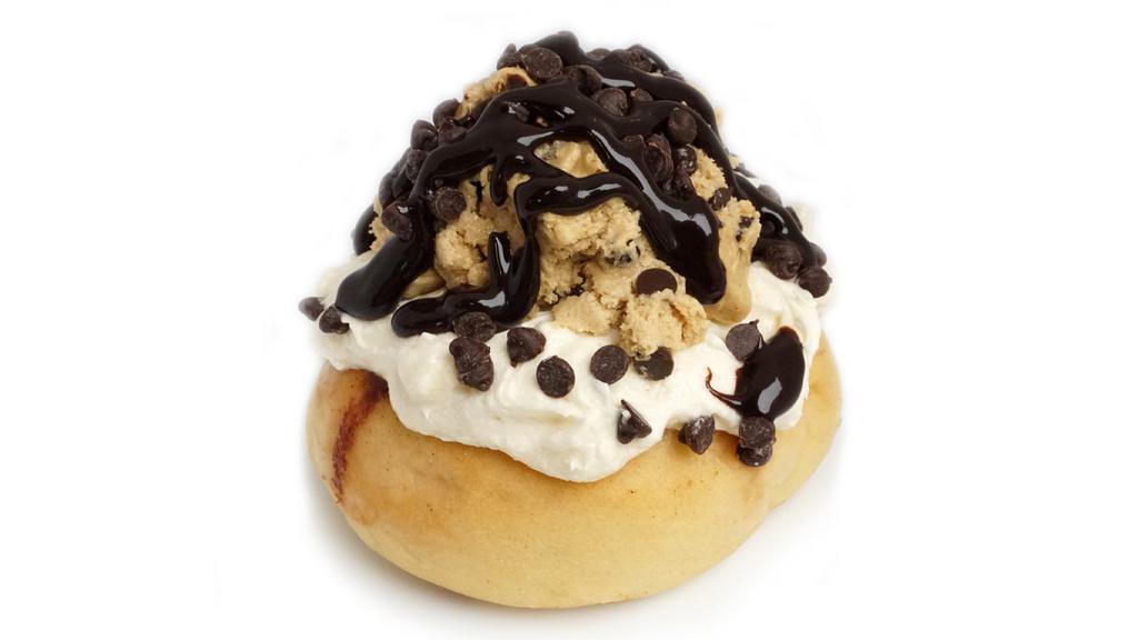 Cookie Monster Roll · cream cheese frosting  topped with cookie dough, chocolate chips and chocolate drizzle.