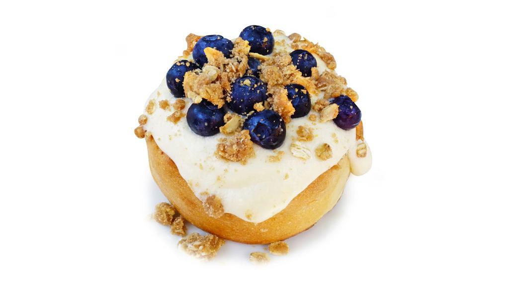 Blueberry Pie Roll · cream cheese frosting topped with blueberries and pie crumble