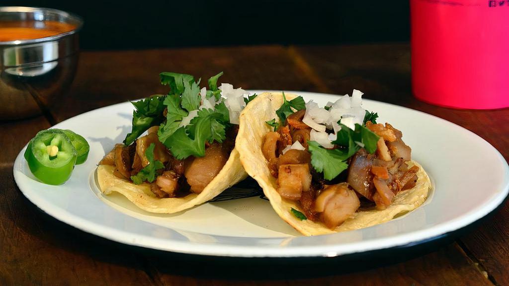 Tacos · Small tortilla, onions, cilantro and your choice of meat / Tortilla pequeña, cebollas, cilantro y su elección de carne.