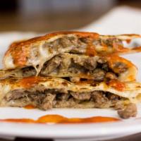 Quesadilla · Flour tortilla, cheese and your choice of meat.