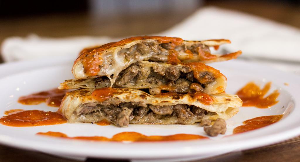 Quesadilla · Flour tortilla, cheese and your choice of meat.