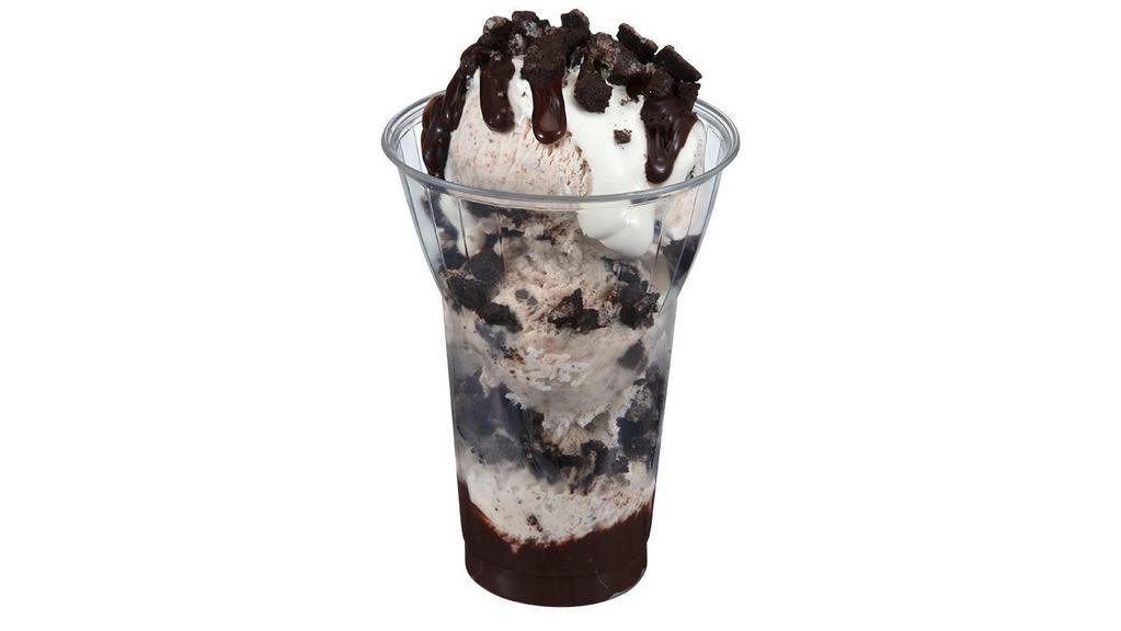 Oreo® Layered Sundae · Rejoice with layers of our OREO® Cookies 'n Cream ice cream, hot fudge and chopped OREO® cookie pieces, topped with marshmallow, more hot fudge & OREO® cookie pieces.