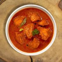 Burmese Style Chicken Curry  · Free range chicken thighs simmered with freshly ground spices. Gluten-free.