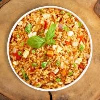 Pine Nut Fried Rice · Brown rice with pine nuts, pea leaves, eggs and garlic. Vegan option available. Gluten-free.