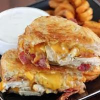 Bacon Cheddar Ranch Grilled Cheese · Melted cheddar, crisp bacon, and ranch dressing between two slices of buttery grilled bread.