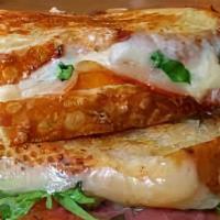 Grown Up Grilled Cheese · Melted cheddar, mozzarella, and jack cheese between two slices of buttery grilled bread.
