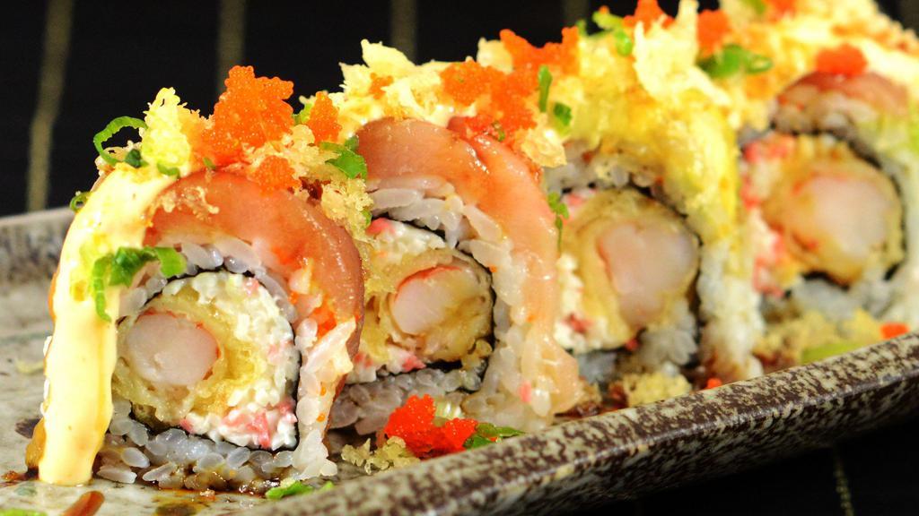 Joe's Roll · Crabmeat and shrimp tempura topped with albacore, avocado, tobiko and tempura flakes on top.