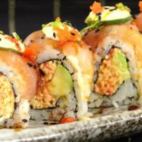 Alhambra Roll · Spicy crab meat, avocado topped with jalapeño, white tuna, and spicy sauce.