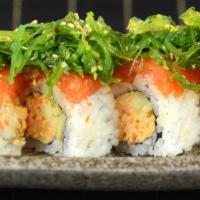 Aloha Roll · spicy crab meat and cucumber topped with spicy salmon and seaweed salad.
