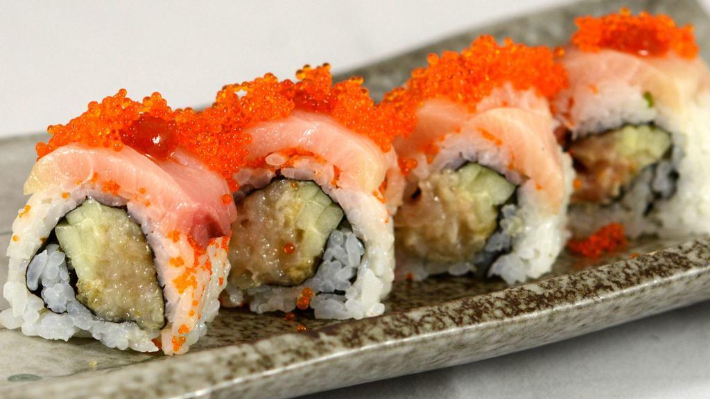 Hamachi Deluxe Roll · Spicy hamachi and cucumber topped with hamachi, tobiko and spicy sauce