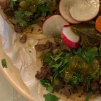 Tacos · cilantro,  onion  and salsa