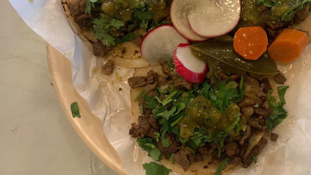 Tacos · cilantro,  onion  and salsa