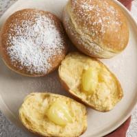 Cream Krapfen · Filled with the famous custard with powdered sugar