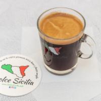 Caffe’ Americano · Espresso shots topped with hot water create a light layer of crema culminating in this wonde...