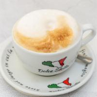 Cappuccino · Dark, rich espresso lies in wait under a smoothed and stretched layer of thick milk foam. An...