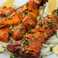 Chicken Breast · Marinated chicken breast on the bone, prepared with our special blend of spices and herbs an...