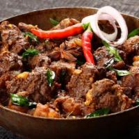 Goat Chilli-Anglo Special · Fresh goat cooked in a spicy-tangy sauce made with soy, tomato and chilli sauce along with c...