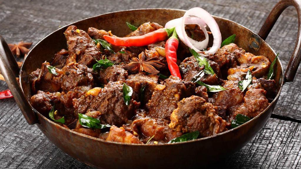 Goat Chilli-Anglo Special · Fresh goat cooked in a spicy-tangy sauce made with soy, tomato and chilli sauce along with chillies, ginger and garlic.
