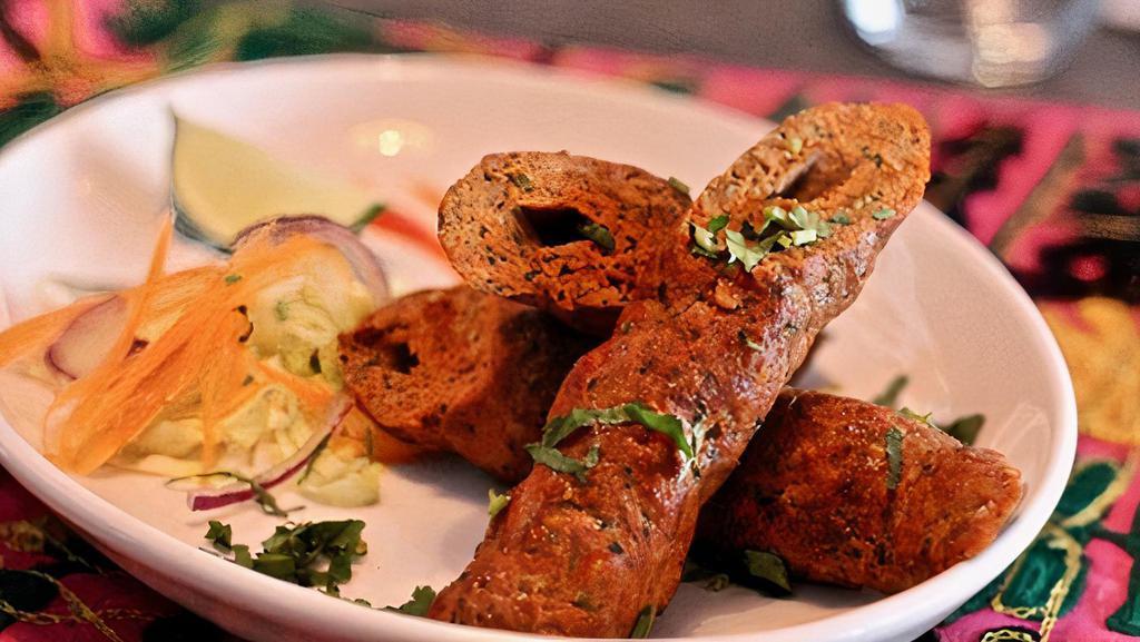 LAMB SHEEKH KEBAB · #Lamb #Sheekh #Kebab: Mince lamb marinated in yogurt, ginger and spices then roasted in the tandoor, served with fresh lemon and mint chutney.