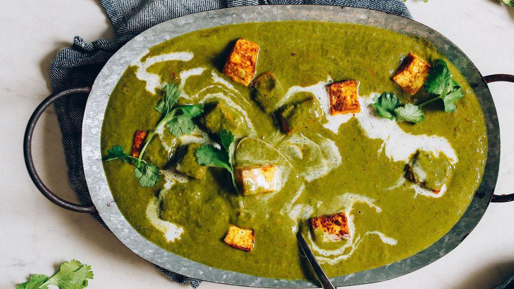 Palak Paneer-Anglo Special · Royal blend of fresh Spinach, Cubed Indian Cheese, and a Hint of Cream that is spiced for mouth watering flavors.