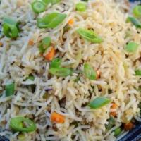 Vegetable Fried Rice · Basamati rice cooked with fried onions, seasonal vegetable  and garlic with light Tibetan sa...