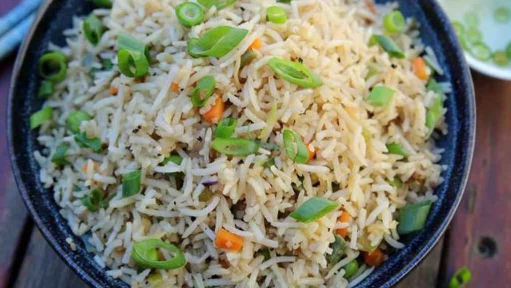Vegetable Fried Rice · Basamati rice cooked with fried onions, seasonal vegetable  and garlic with light Tibetan sauce.