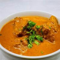 Home Style Chicken Curry · Chicken prepared in a flavor curry infused with locally grown ginger, garlic, and coriander.
